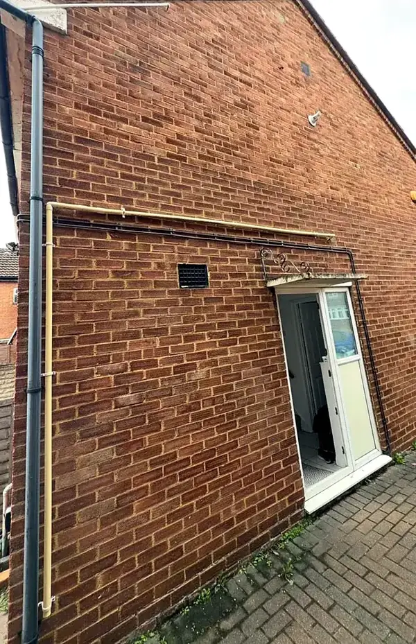 Brick side wall checked for wall type and construction during an EPC in Luton