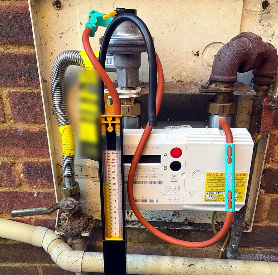 Gas tightness test at the meter with a manometer during a gas safety check in Luton